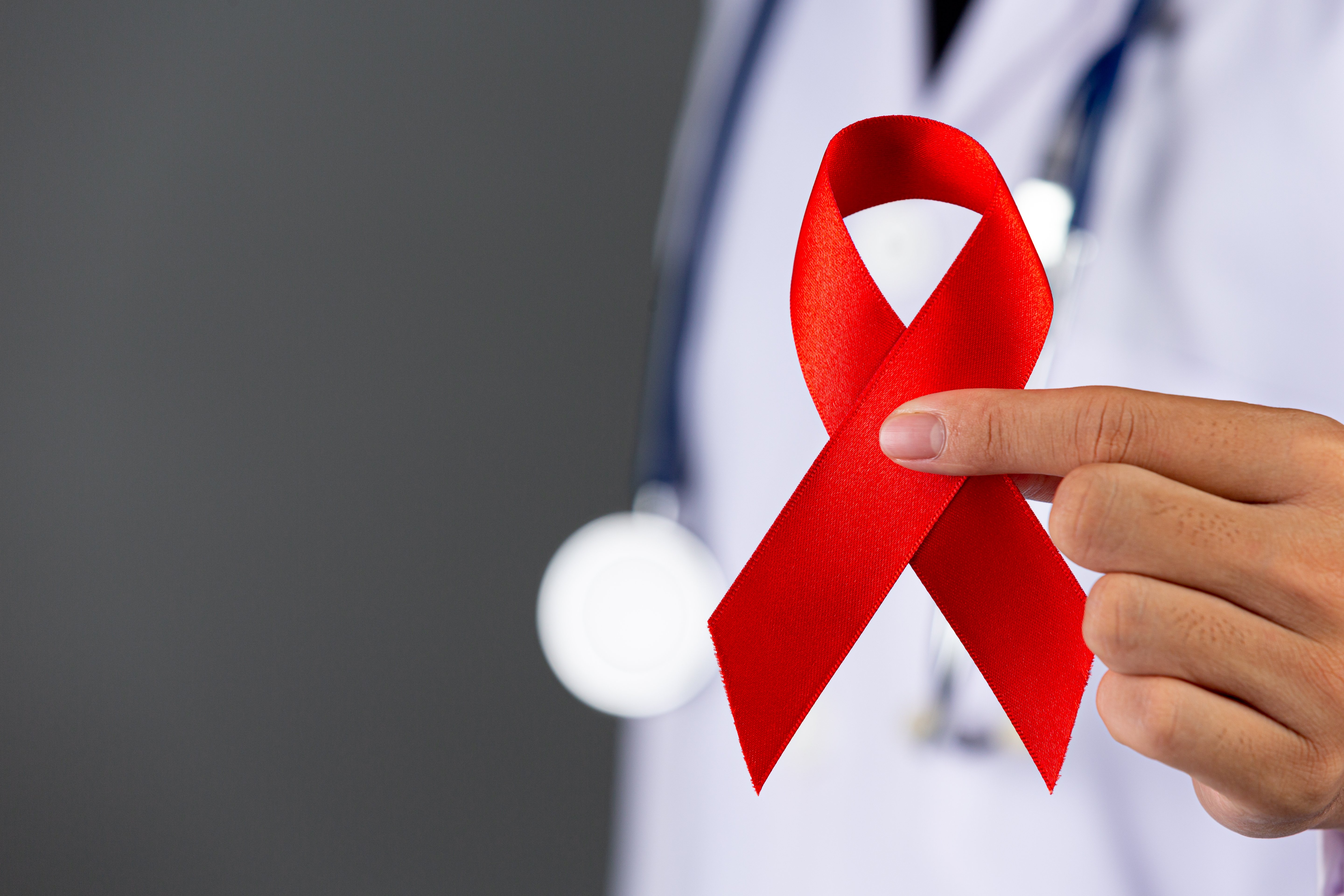 doctor-holds-red-ribbon-hiv-awareness-awareness-world-aids-day-world-sexual-health-day